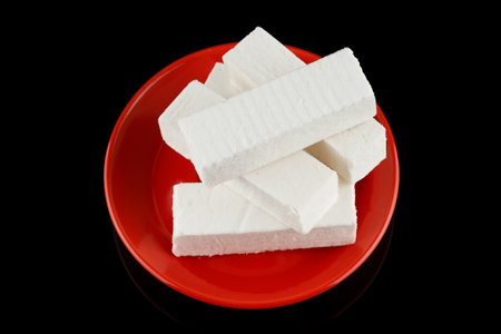 Pastilla white confectionery product on black.の写真素材