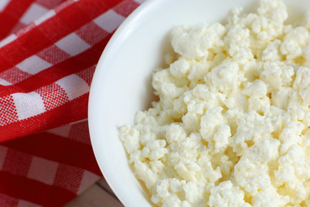 Homemade cheese in a white bowl.の写真素材