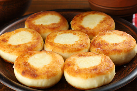 curd fritters on a plate in the village. traditional delicious food.の写真素材