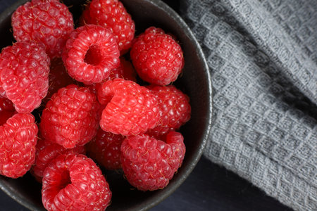 Raspberry in a bowl. Appetizing red raspberry.の写真素材