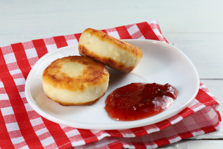 curd fritters with raspberry jam. traditional food. beautiful photo of food.の写真素材