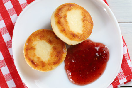 curd fritters with raspberry jam. traditional food. beautiful photo of food.の写真素材