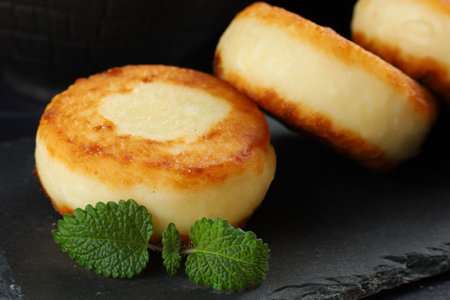 curd fritters close-up Food photo in a dark tone.の写真素材