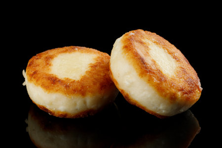 curd fritters Isolate on a black background.の写真素材