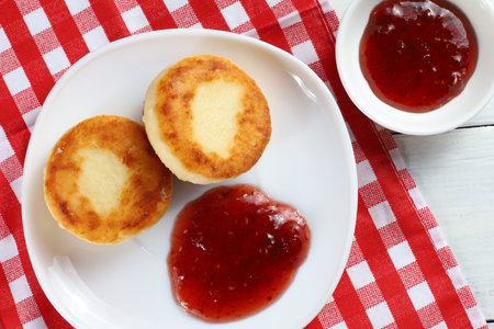 curd fritters with raspberry jam. traditional food. beautiful photo of food.の写真素材