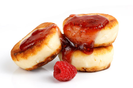 curd fritters and raspberry jam on white isolate.の写真素材