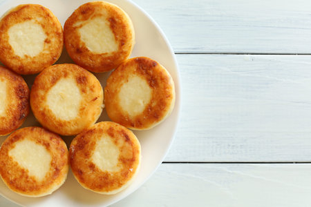 curd fritters on a plate. Sweet delicious cottage cheese pancakesの写真素材