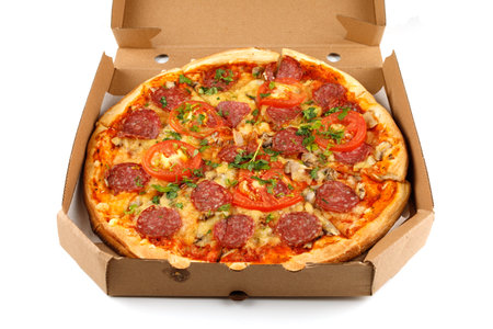 Pizza with sausage in a box on a white isolate. Pizza delivery box on white background.の写真素材