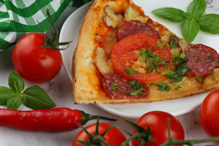 Sliced pizza in a plate. Close up view of a slice of a pizzaの写真素材