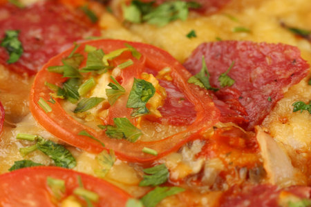 Pizza with sausage close-up. Pizza with Mozzarella cheese, salami, pepper.の写真素材