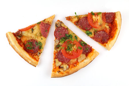 Sliced pizza on white isolate. Three slices of pizzaの写真素材