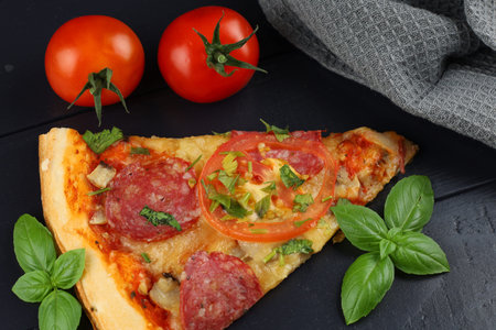 Sliced pizza with vegetables. Pizza on the table. sliced pizza with cheese, tomatoes, pepper, mushroomsの写真素材