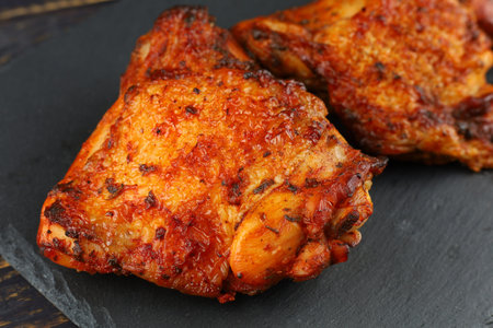 chicken thighs Baked. Roasted chicken thighs. Appetizing cooked chicken.の写真素材