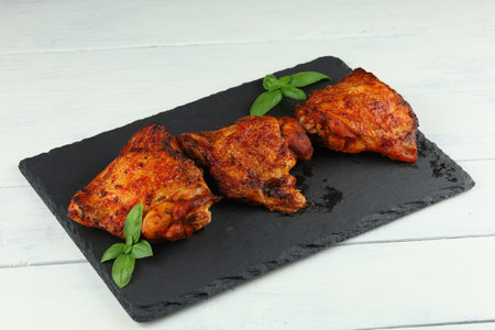 Chicken thighs baked with vegetables and spicesの写真素材