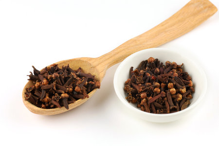 Clove spice in a wooden spoonの写真素材