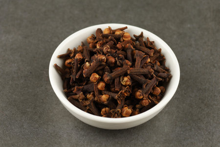Clove spice in a white ceramic vesselの写真素材