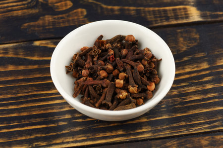 Clove spice in a white ceramic vesselの写真素材