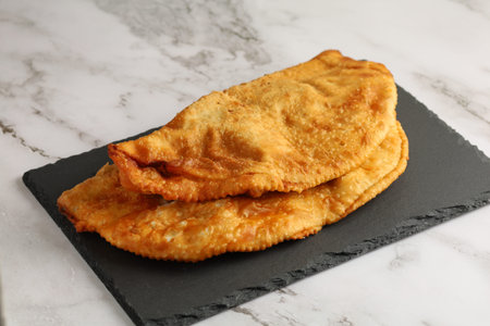 Chebureks with meat. East meat pastry cheburek. Fried chebureks close-upの写真素材