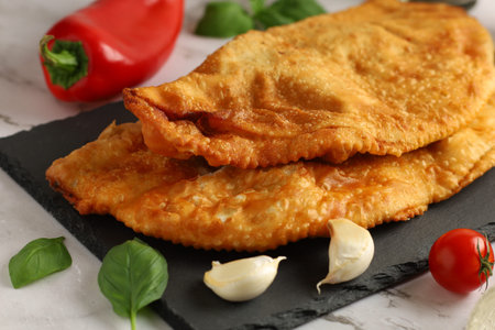 Chebureks with meat. East meat pastry cheburek. Fried chebureks close-upの写真素材