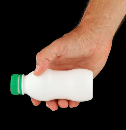 White plastic bottle in handの写真素材