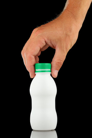 White plastic bottle in handの写真素材