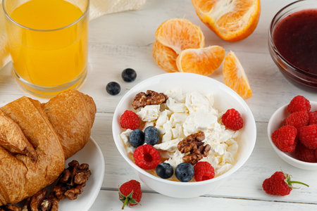 Homemade cheese with berries and nuts. breakfast food with Quarkの写真素材