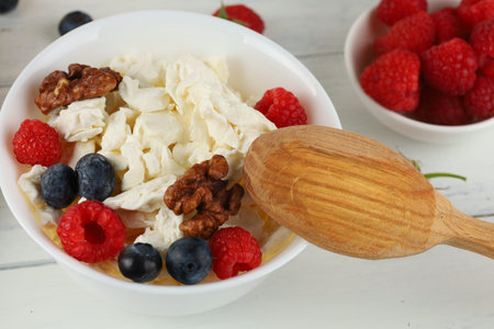 croissant breakfast with cheese, berries and nuts. Hearty and healthy food.の写真素材