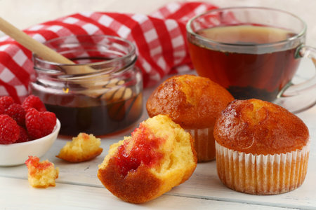 Breakfast with muffins. Delicious pastries on the tableの写真素材