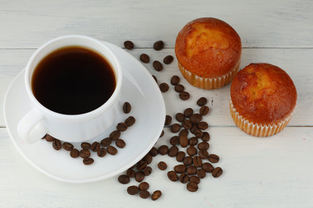 muffin and coffee on white. Delicious breakfast.の写真素材