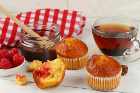Breakfast with muffins. Delicious pastries on the tableの写真素材