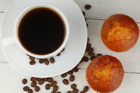 Muffins and coffee in the kitchen. Baked breakfast.の写真素材