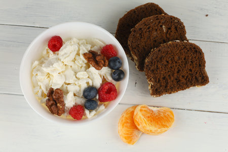 Homemade cheese with fruits. Useful and nutritious food. Proteins with vitamins. Fruit dessertの写真素材