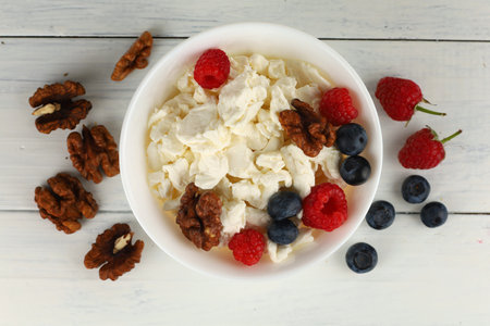 Homemade cheese with berries and nuts. breakfast food with Quarkの写真素材