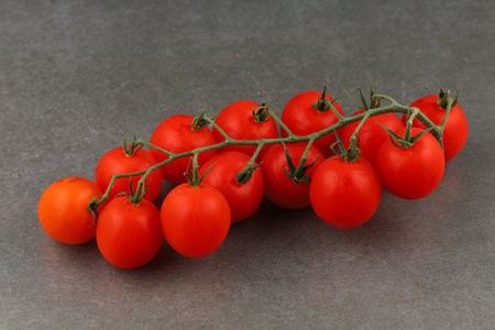 cherry tomatoes on a dark backgroundの写真素材