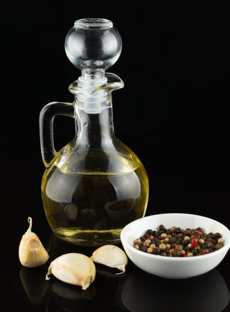 seasoning for cooking: pepper, garlic and oil. seasoning food on blackの写真素材