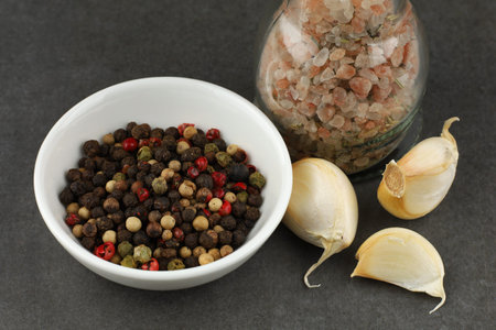 seasoning for cooking: pepper, garlic and salt. seasoning food on concreteの写真素材