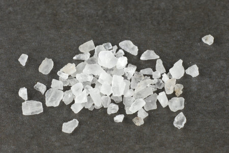 salt sea on a gray background. Coarse salt crystals.の写真素材