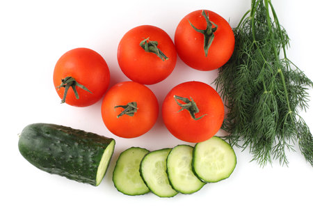 Tomatoes and cucumbers isolate top viewの写真素材