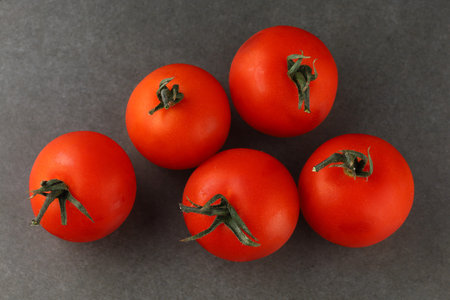 cherry tomatoes on a dark backgroundの写真素材