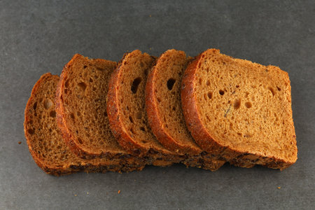 sliced brown bread on grayの写真素材