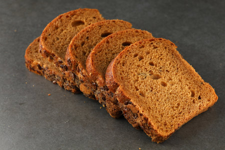 sliced brown bread on grayの写真素材