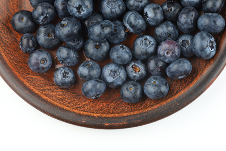 Blueberry in a plate isolateの写真素材