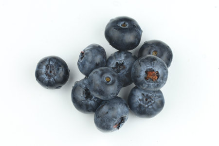 Blueberry berries on a white background. A few blueberries.の写真素材
