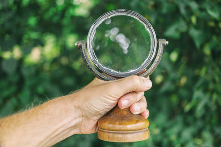 Old mirror in handの写真素材