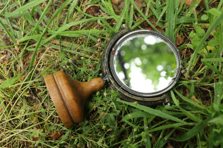 Old mirror on the grassの写真素材