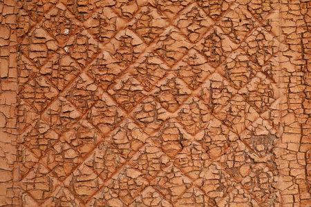 The terracotta surface is old and cracked.の写真素材