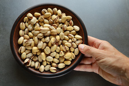 Pistachio nuts. Pistachios in a plate.の写真素材