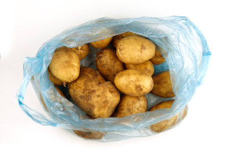 Lots of fruit potatoes. Potatoes in a transparent packageの写真素材