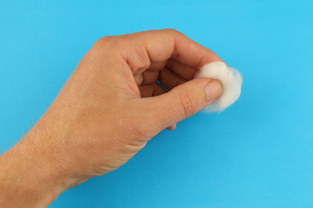 Medical cotton wool in handsの写真素材