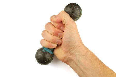 Hand holding dumbbell isolate and close-upの写真素材